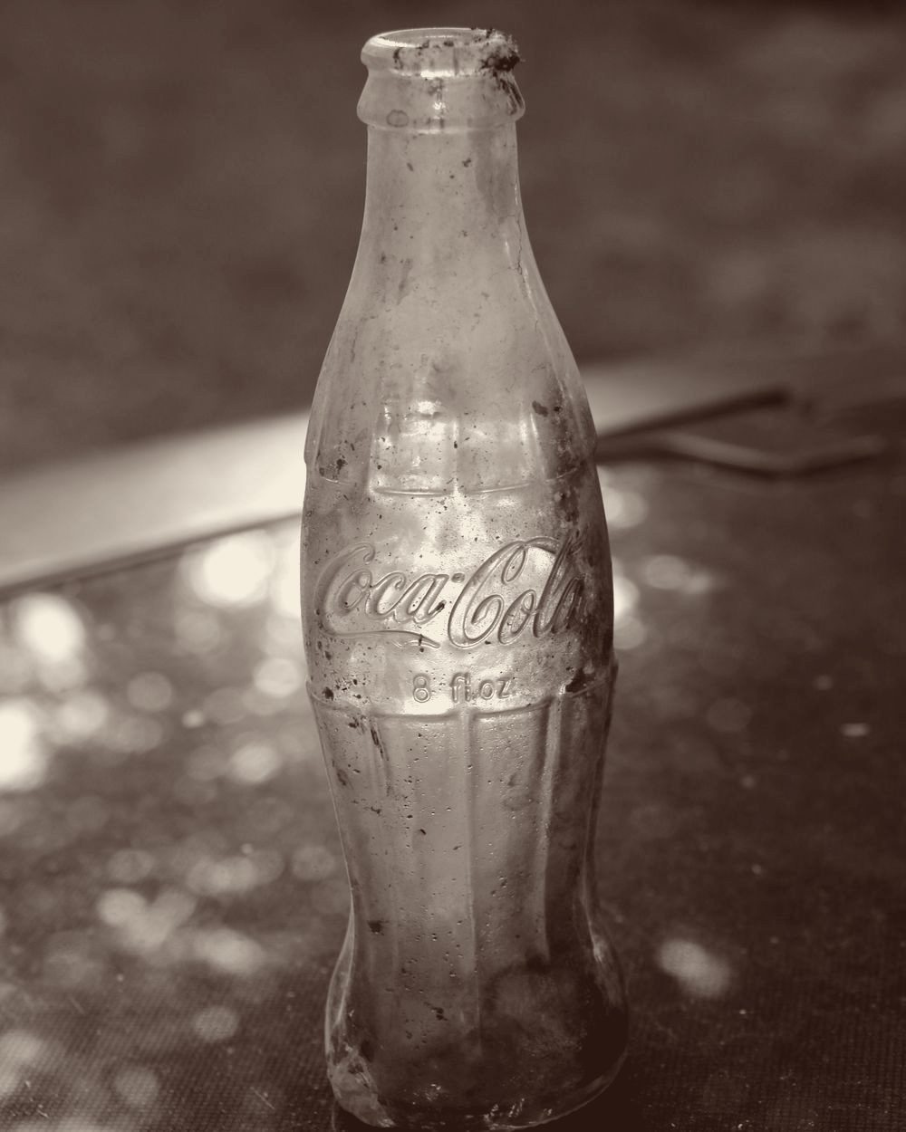 An old glass Coca-Cola contour bottle